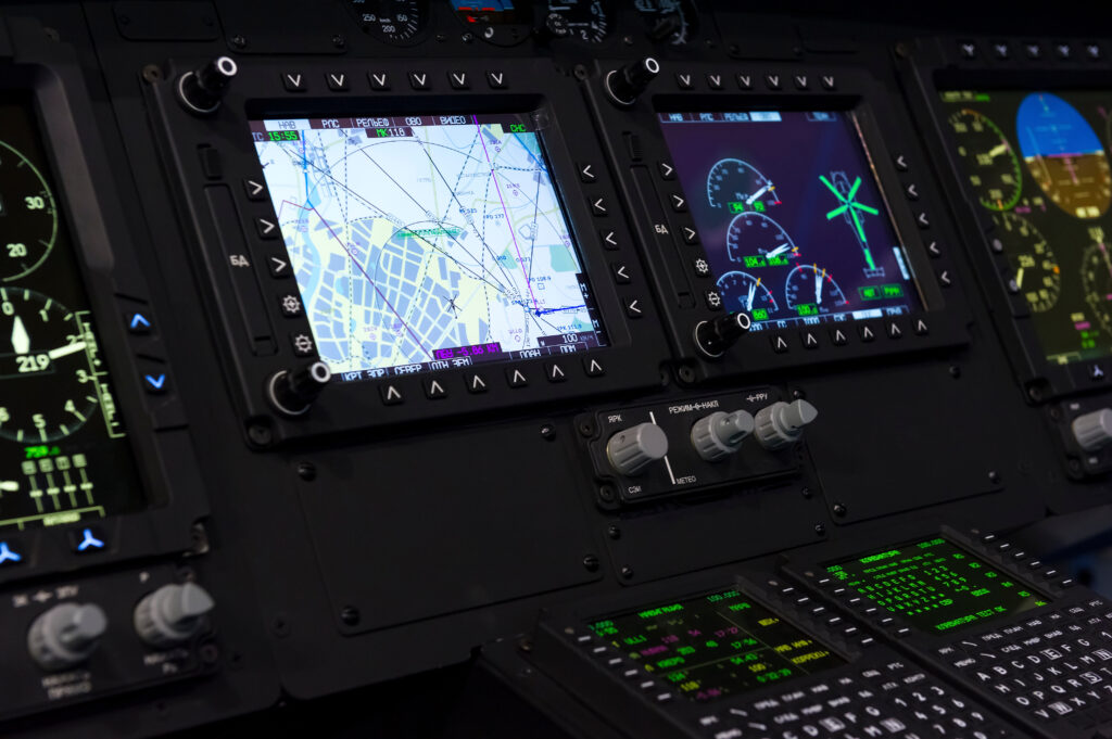 Control panel in military helicopter cockpit, copter dashboard with displays, dials, buttons, switches, faders, knobs, other toggle items, air force, modern aviation and aerospace industry