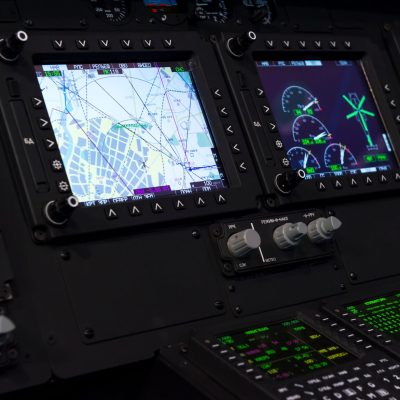 Control panel in military helicopter cockpit, copter dashboard with displays, dials, buttons, switches, faders, knobs, other toggle items, air force, modern aviation and aerospace industry