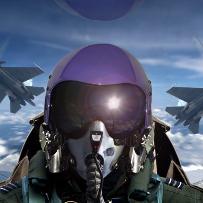 Fighter pilot cockpit view during sunrise
